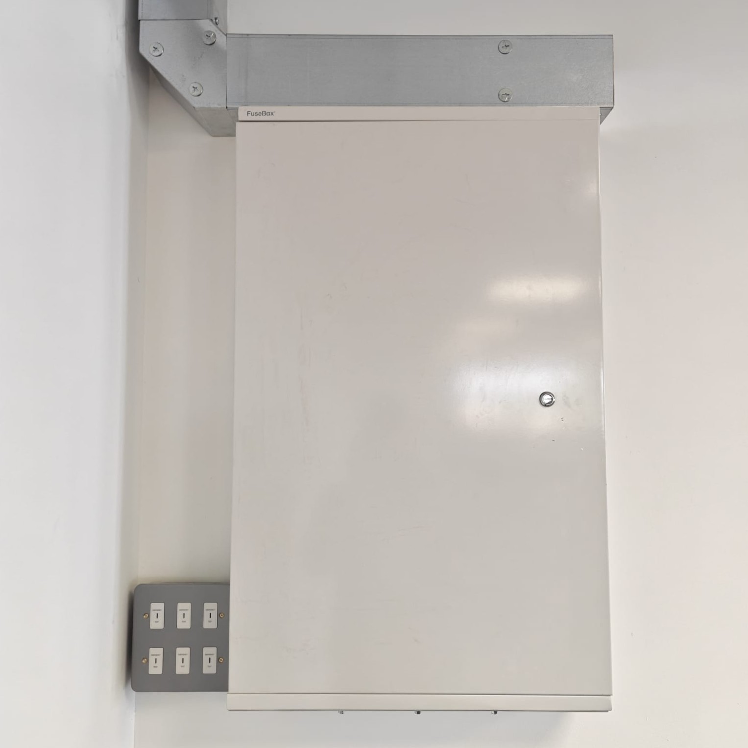 An electrician working in a commercial premises