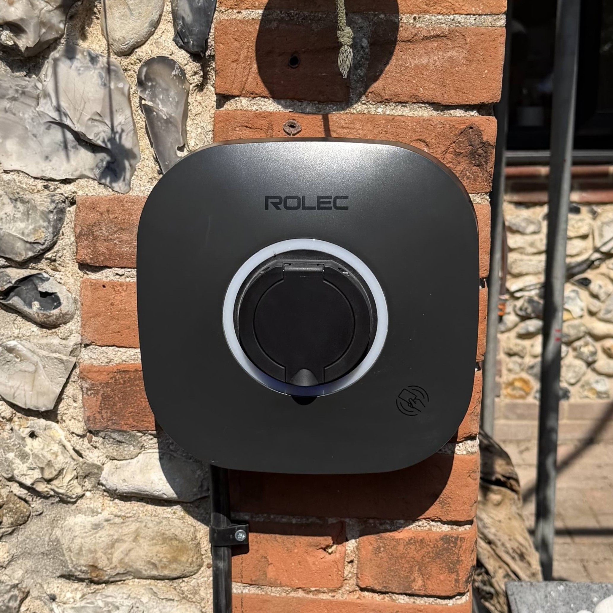 An electric vehicle charging on a home driveway
